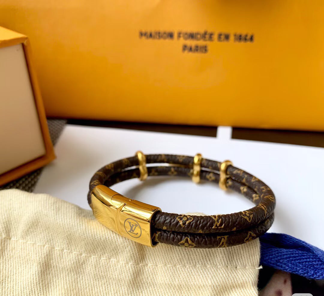 Letter Emblem Bangle in Polished Metal-Tone – Leather Detail – Design 002 styled product view