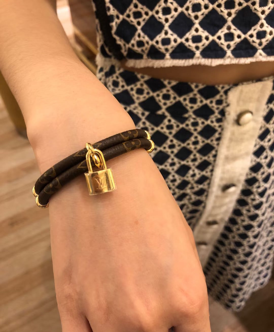 Letter Emblem Bangle in Polished Metal-Tone – Leather Detail front product view