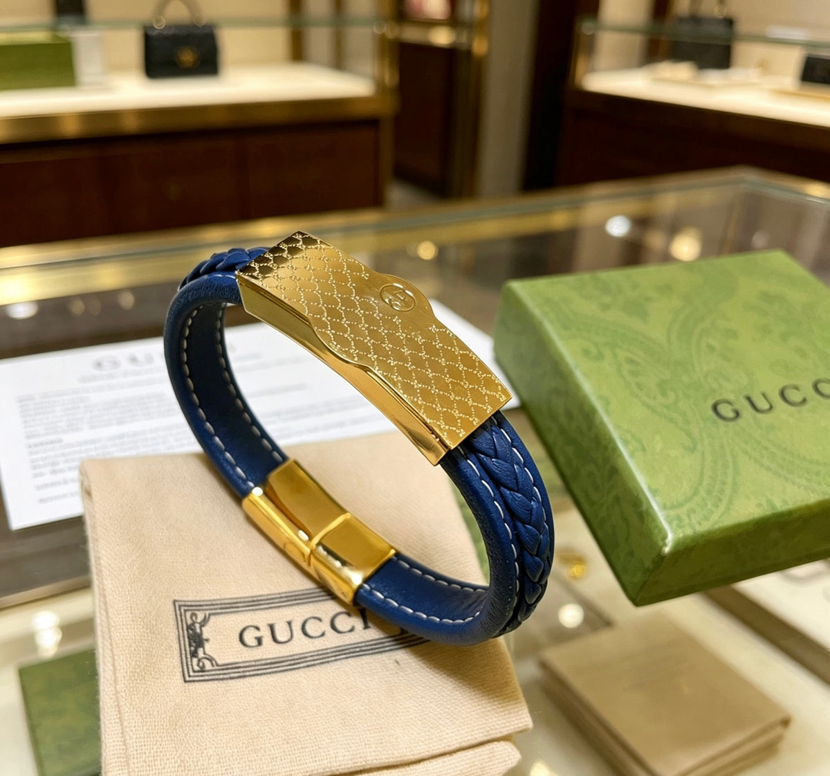 Double-G Emblem Bangle in Polished Metal-Tone – Leather Detail – Design 003 main product view