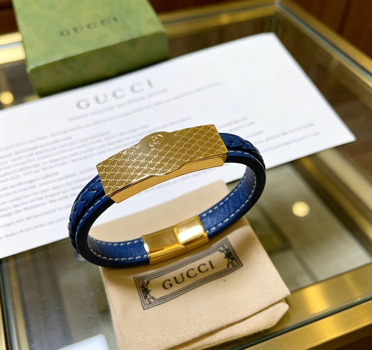 Double-G Emblem Bangle in Polished Metal-Tone – Leather Detail – Design 003 detail view
