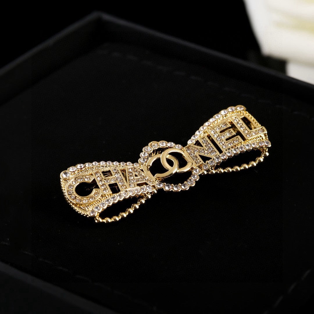 Double-C Emblem Brooch in Polished Metal-Tone – Design 019 detail view