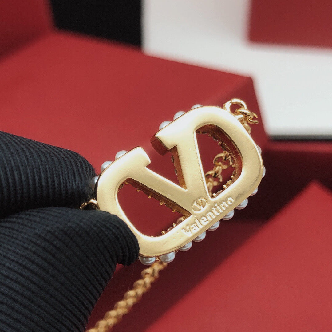 Signature Emblem Pendant Necklace in Gold-Tone – Design 04 close-up view
