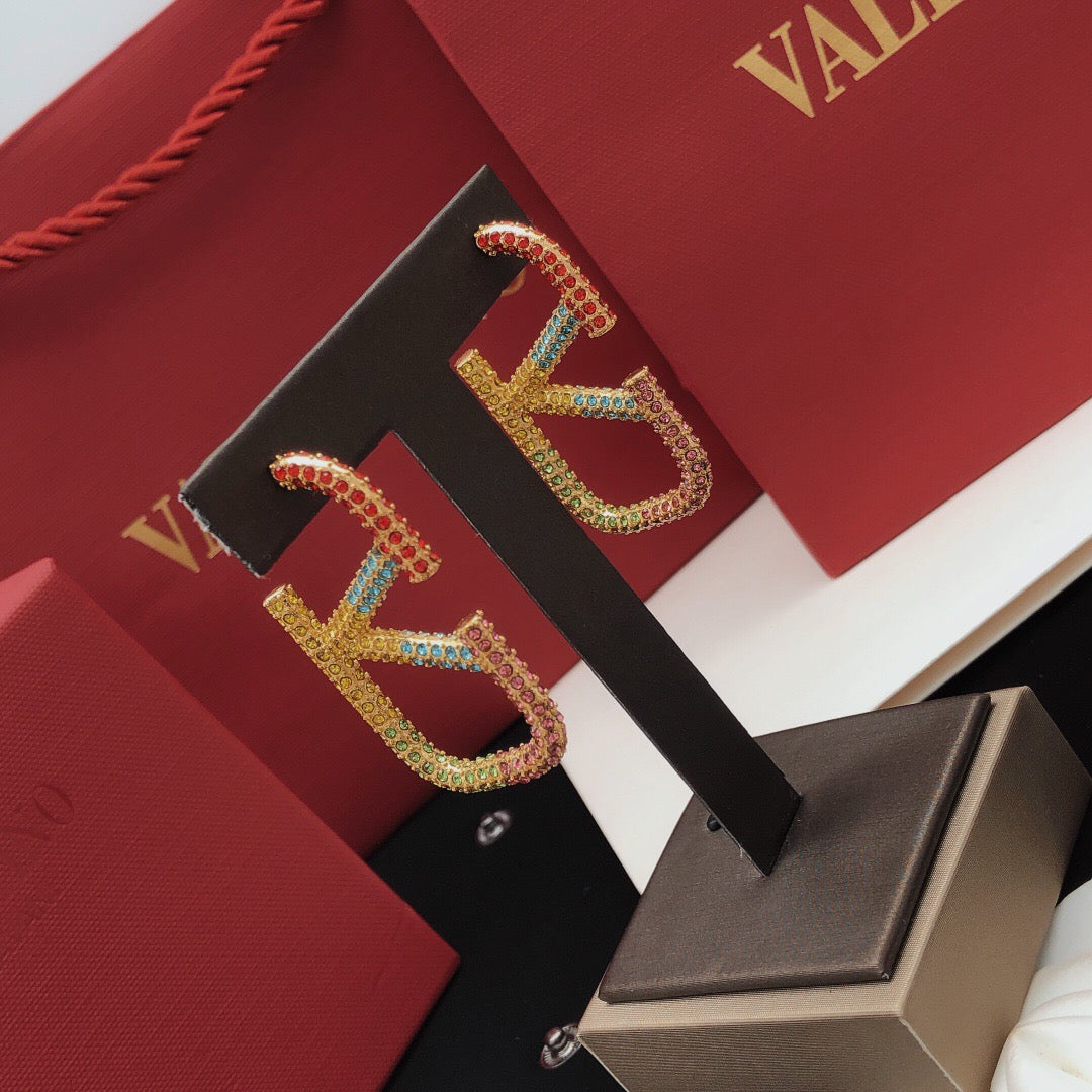 V Emblem Crystal-Accent Statement Earrings – Design 02 styled detail