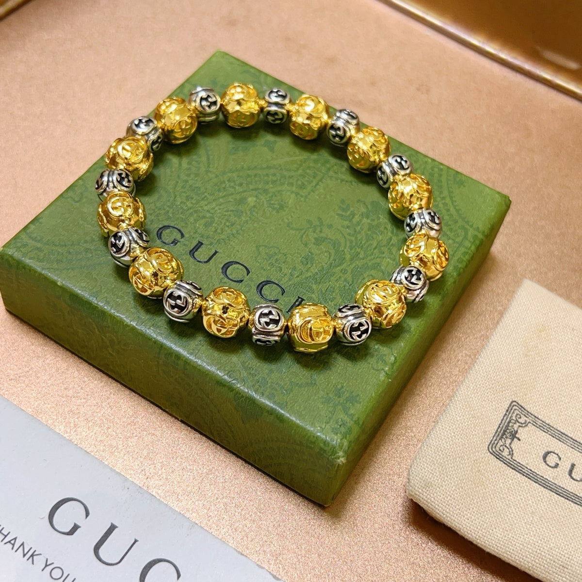 Double-G Emblem Bracelet in Polished Metal-Tone – Design 010 front product view