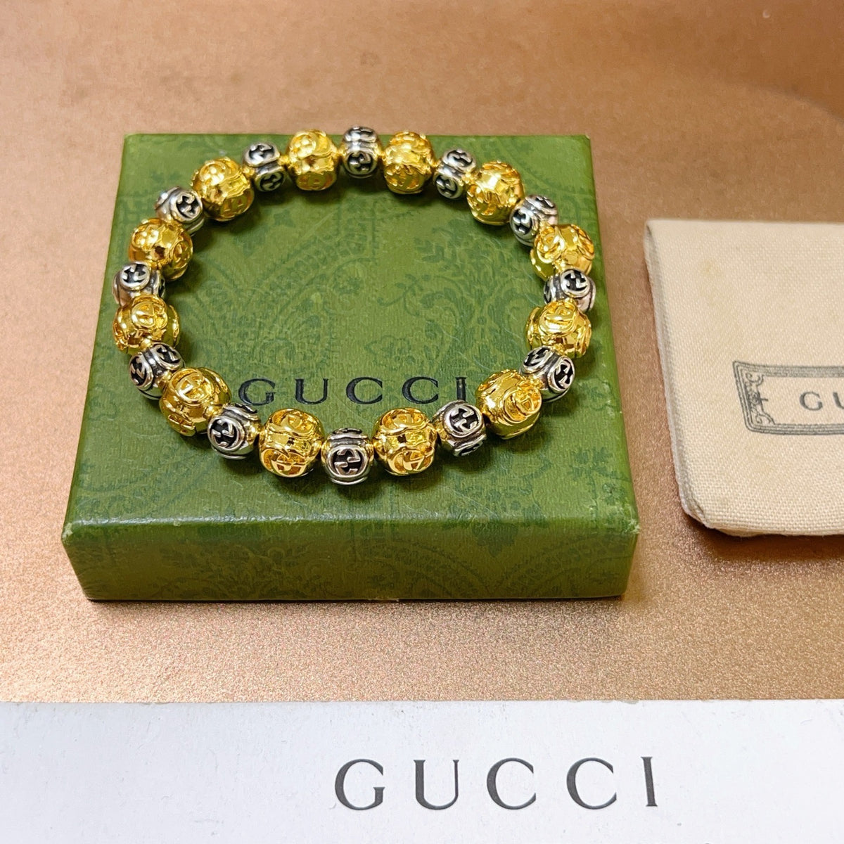 Double-G Emblem Bracelet in Polished Metal-Tone – Design 010 front product view