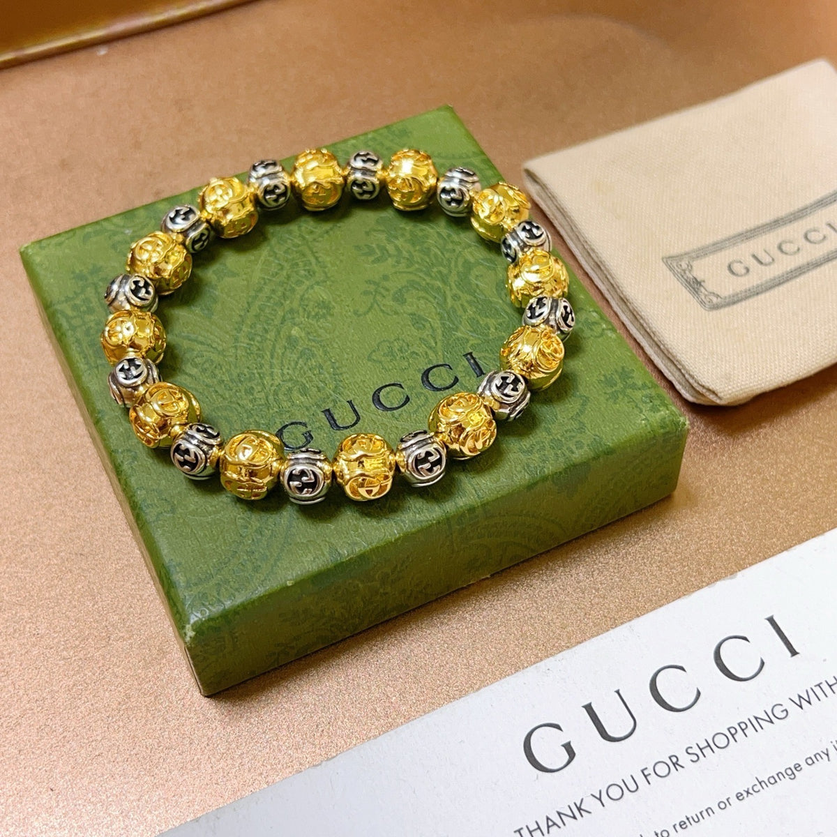 Double-G Emblem Bracelet in Polished Metal-Tone – Design 010 close-up detail