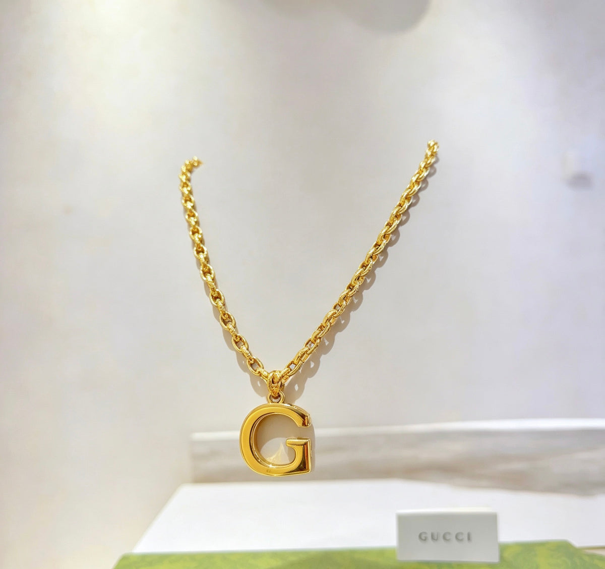 Double-G Emblem Pendant Necklace in Gold-Tone – Design 006 close-up detail