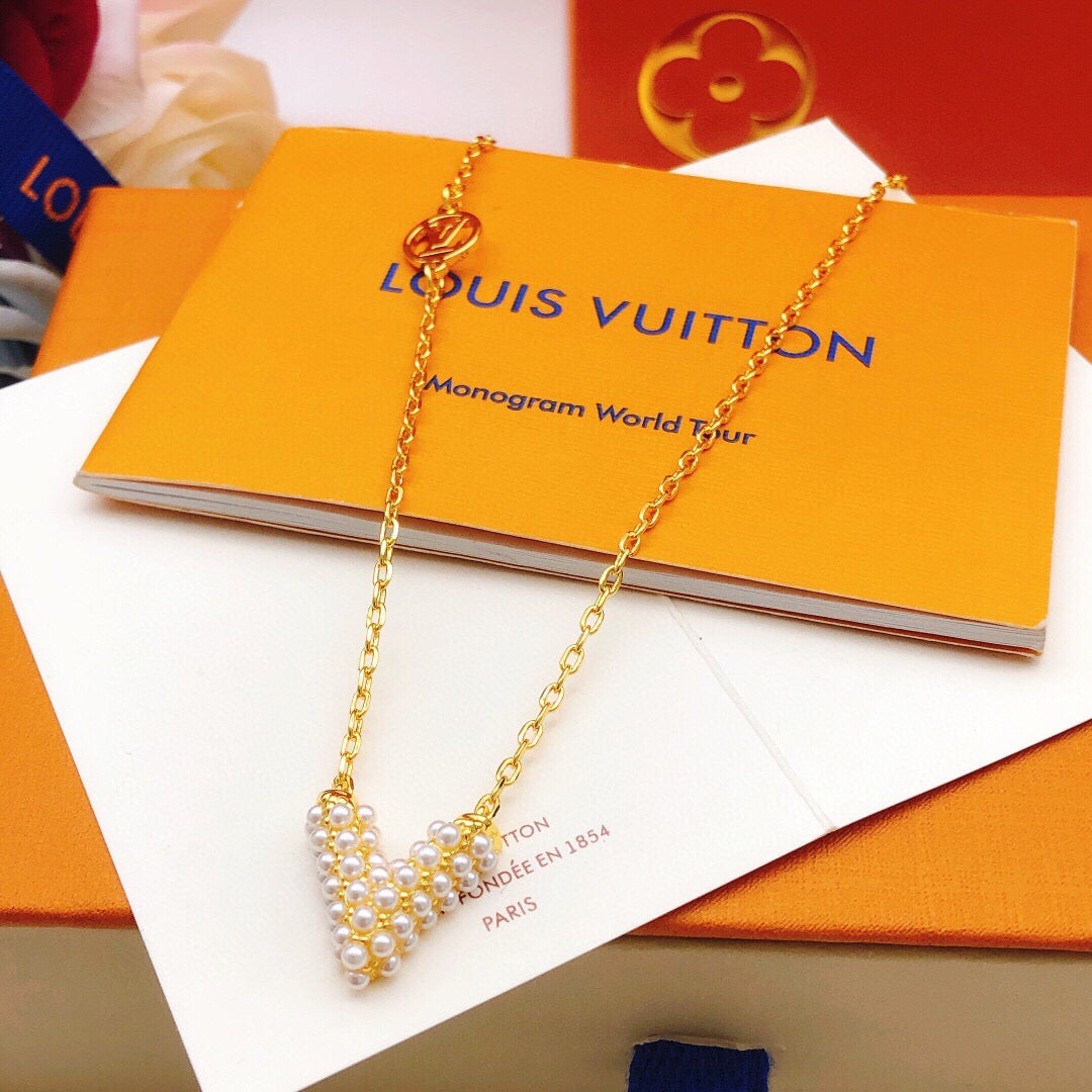 Geometric Emblem Pendant Necklace in Gold-Tone – Pearl Detail close-up detail