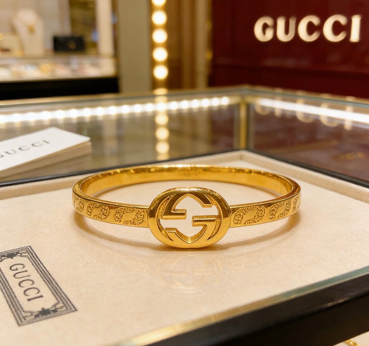 Double-G Emblem Bangle in Polished Metal-Tone – Design 012 detail view