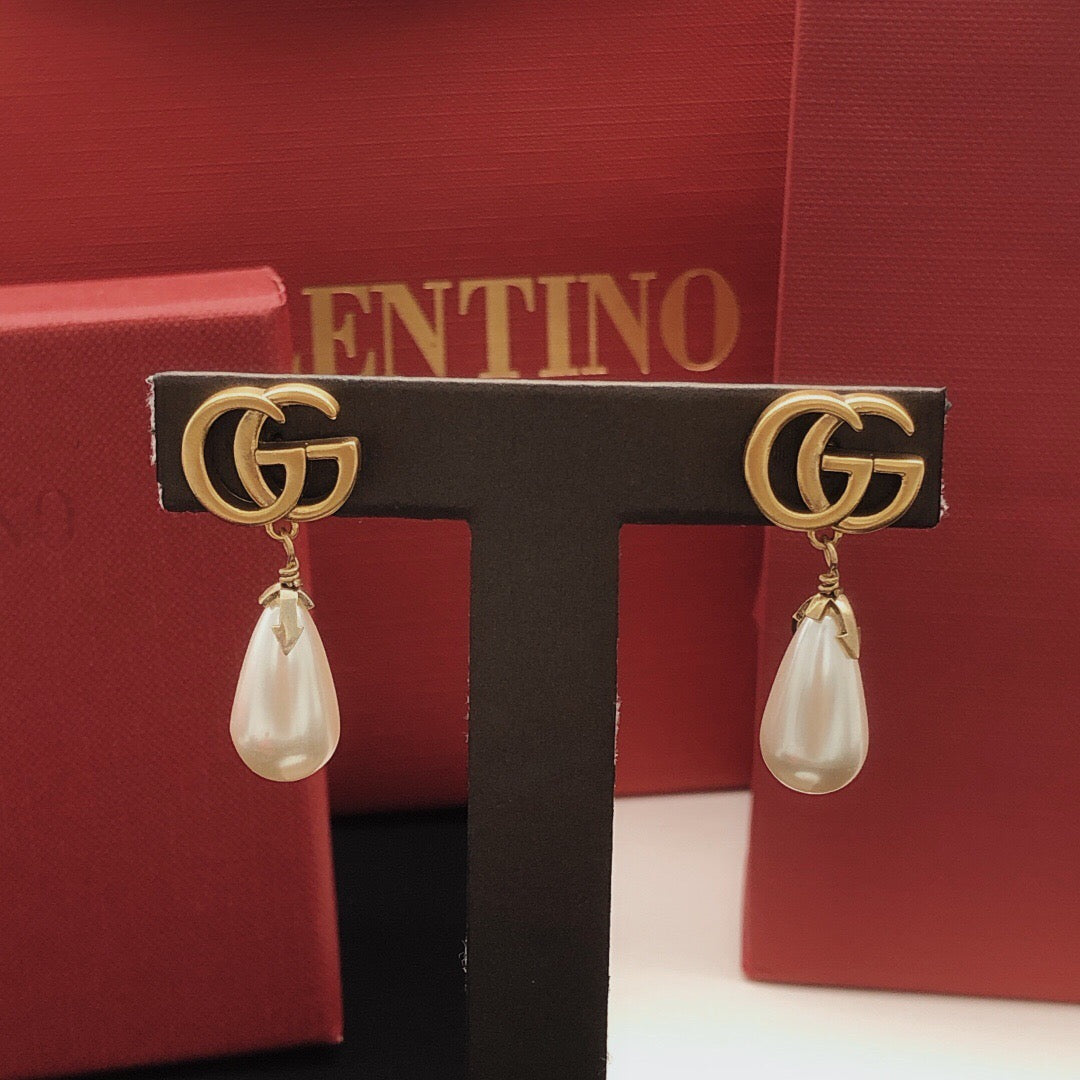 Geometric Emblem Stud Earrings in Gold-Tone – Design 001 close-up detail