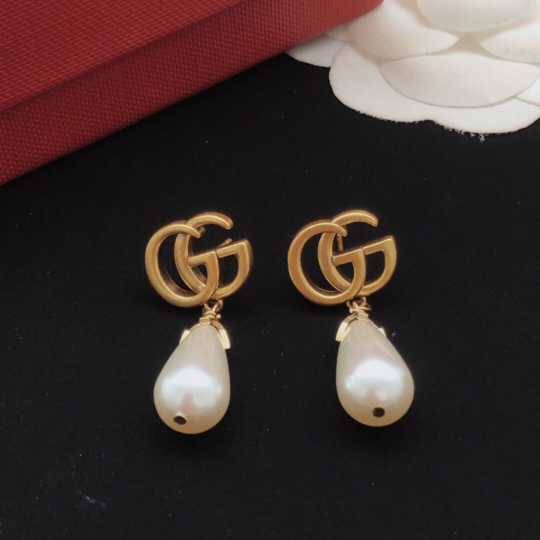 Geometric Emblem Stud Earrings in Gold-Tone – Design 001 detail view