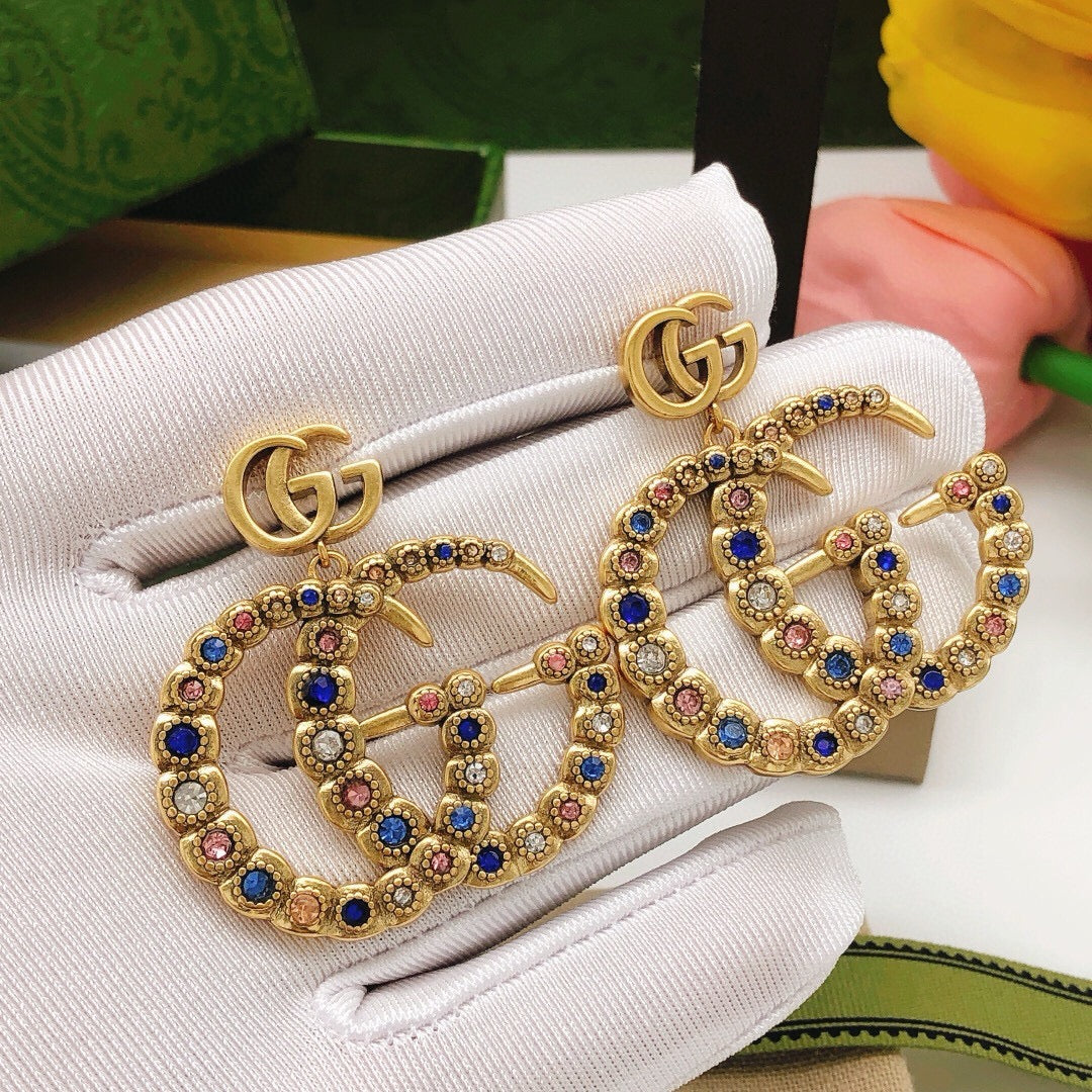 Double-G Emblem Stud Earrings in Polished Metal-Tone – Vintage Detail – Design 003 close-up detail