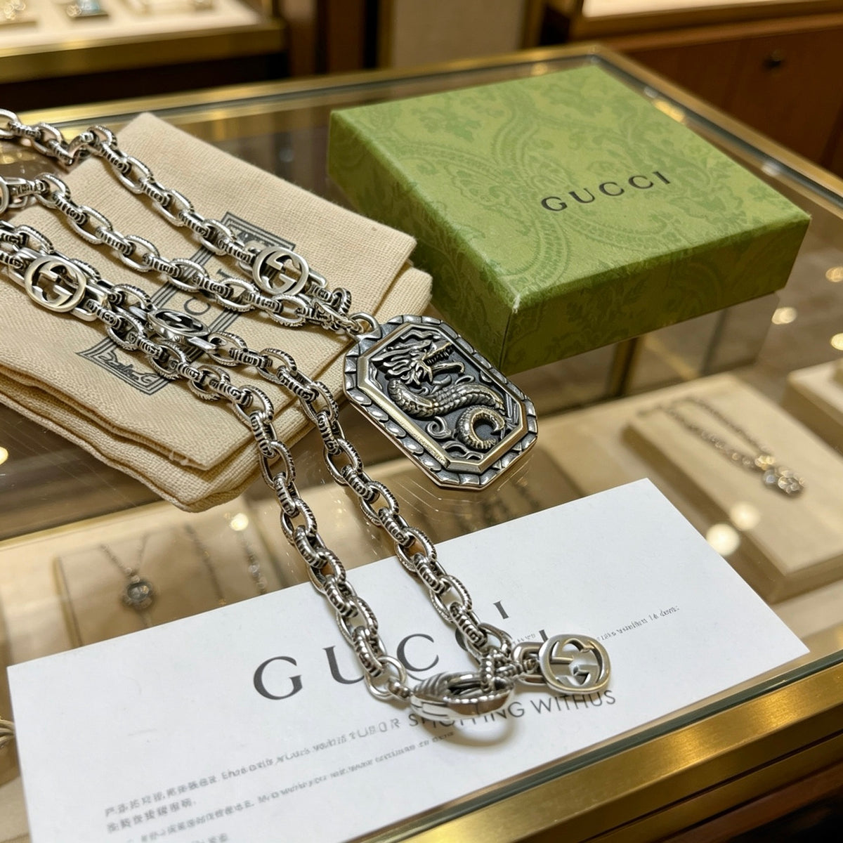 Double-G Emblem Pendant Necklace in Polished Metal-Tone – Design 056 close-up detail