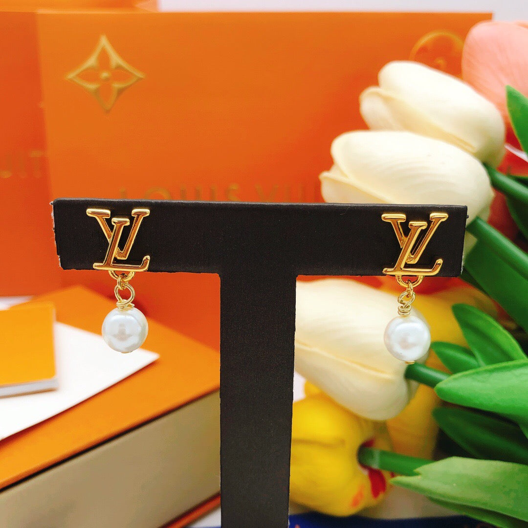 Geometric Emblem Stud Earrings in Gold-Tone – Pearl Detail close-up detail