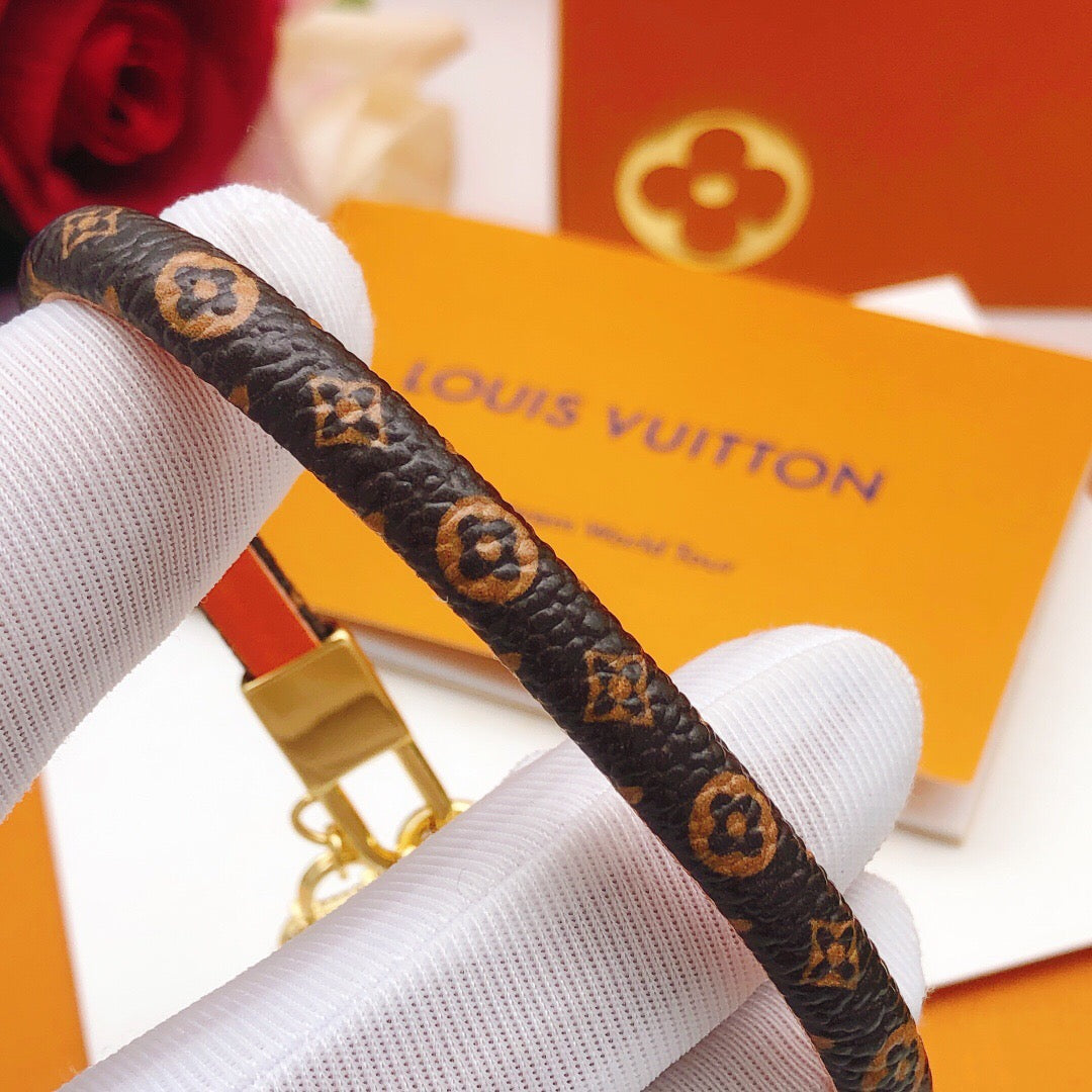 Geometric Emblem Bangle in Gold-Tone – Leather Detail detail view