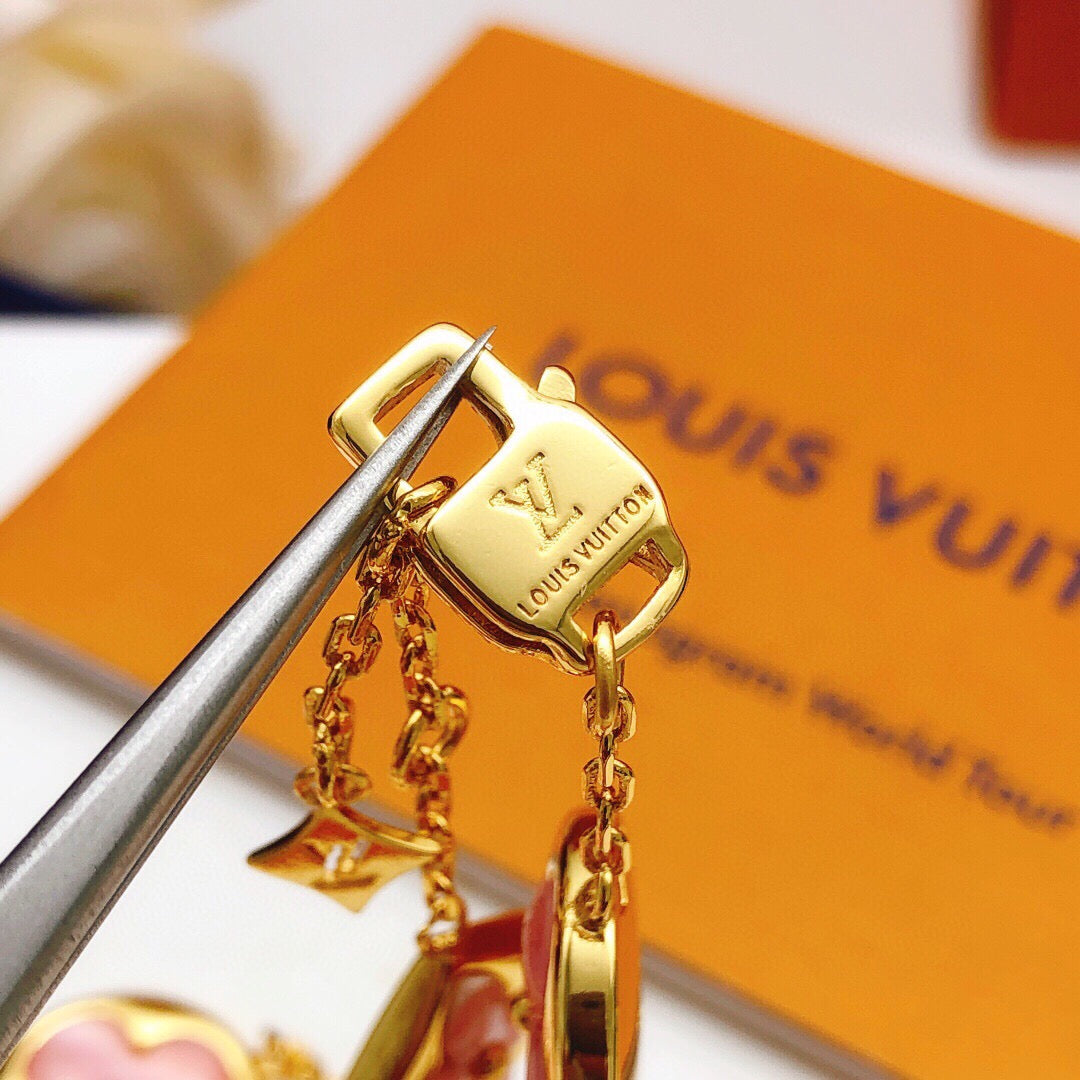 Geometric Emblem Bracelet in Gold-Tone – Pink Detail styled product view