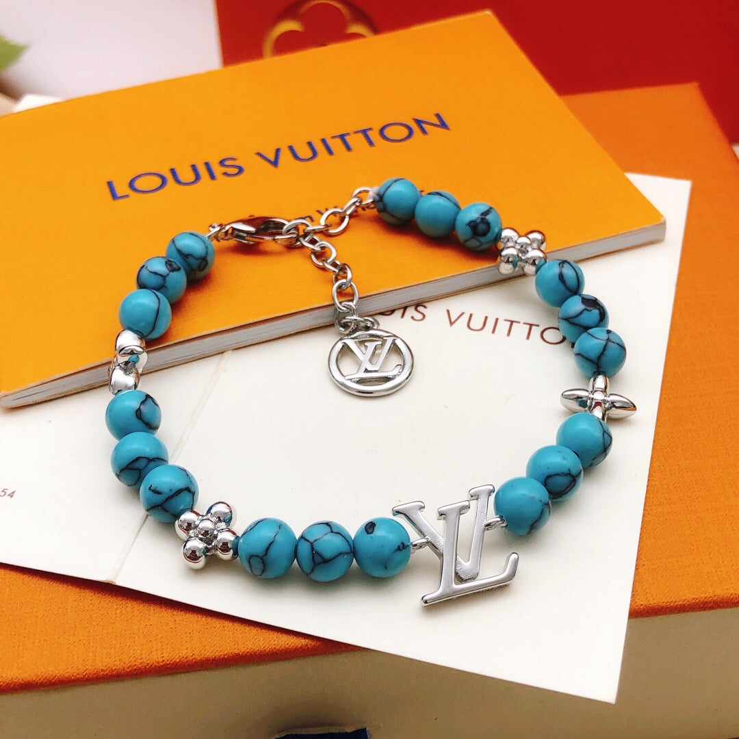 Geometric Emblem Bracelet in Gold-Tone – Blue Detail – Design 002 front product view