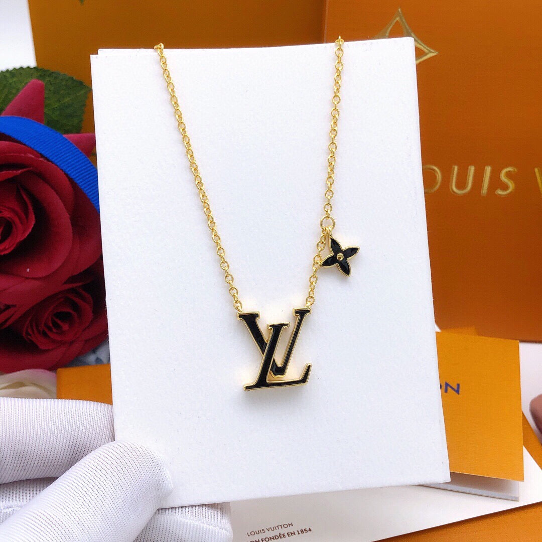 Geometric Emblem Pendant Necklace in Gold-Tone – Black Detail close-up detail
