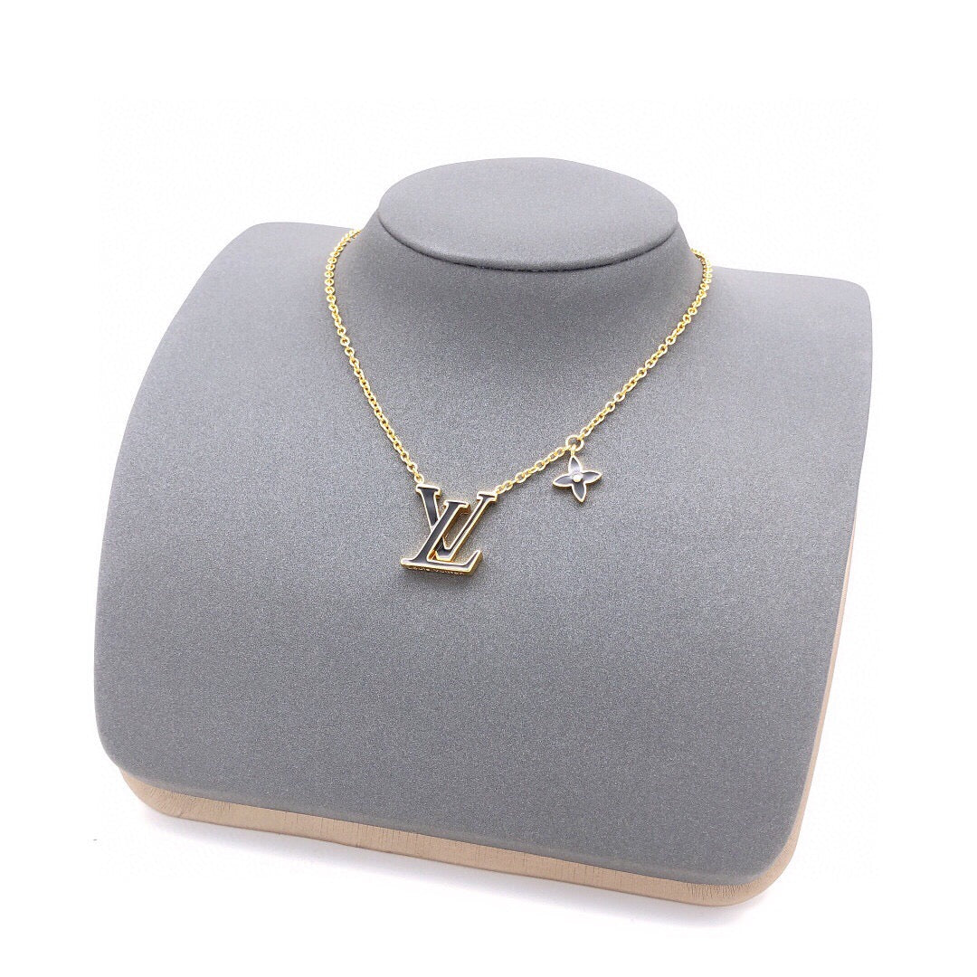 Geometric Emblem Pendant Necklace in Gold-Tone – Black Detail front product view