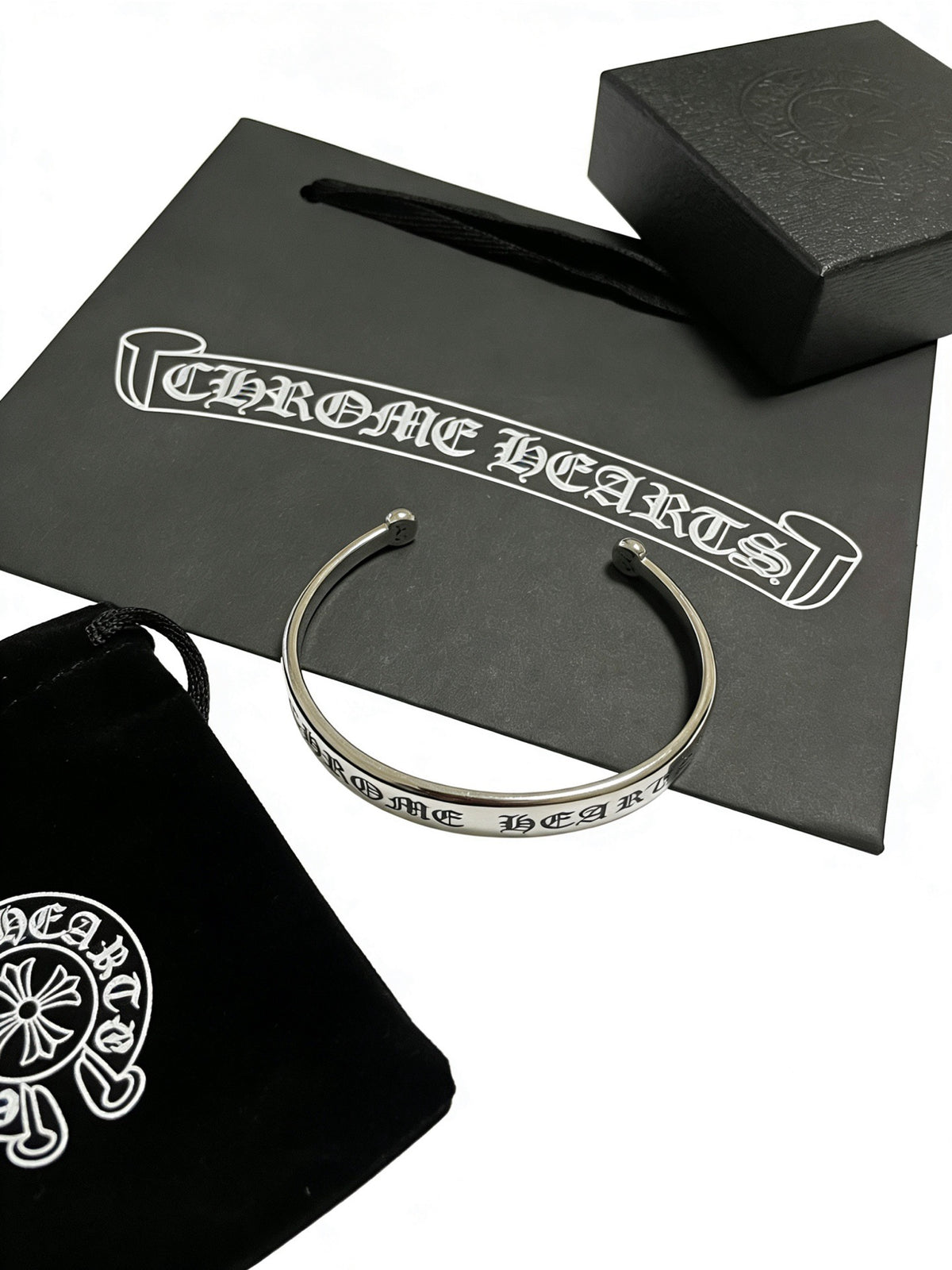 Signature Emblem Bangle in Polished Metal-Tone – Design 009 close-up detail
