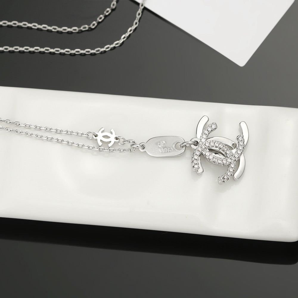 Double-C Emblem Pendant Necklace in Polished Metal-Tone – Design 001 close-up detail