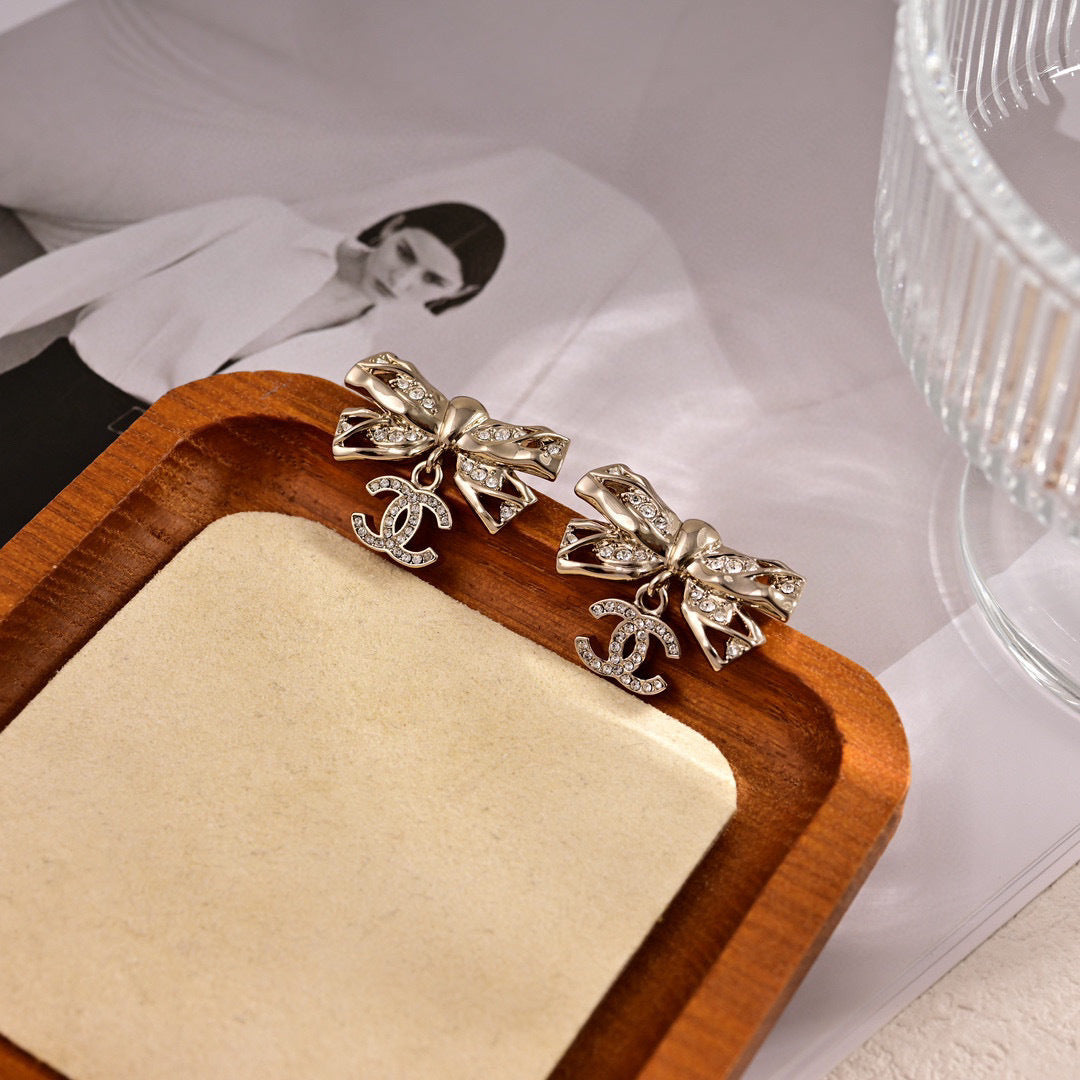 Signature Emblem Stud Earrings in Polished Metal-Tone – Design 004 close-up detail