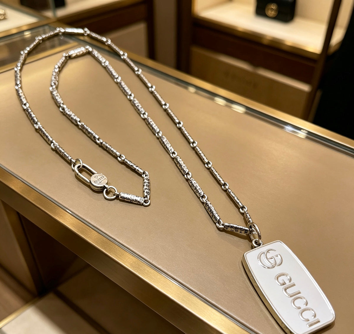 Double-G Emblem Pendant Necklace in Polished Metal-Tone – Design 001 detail view
