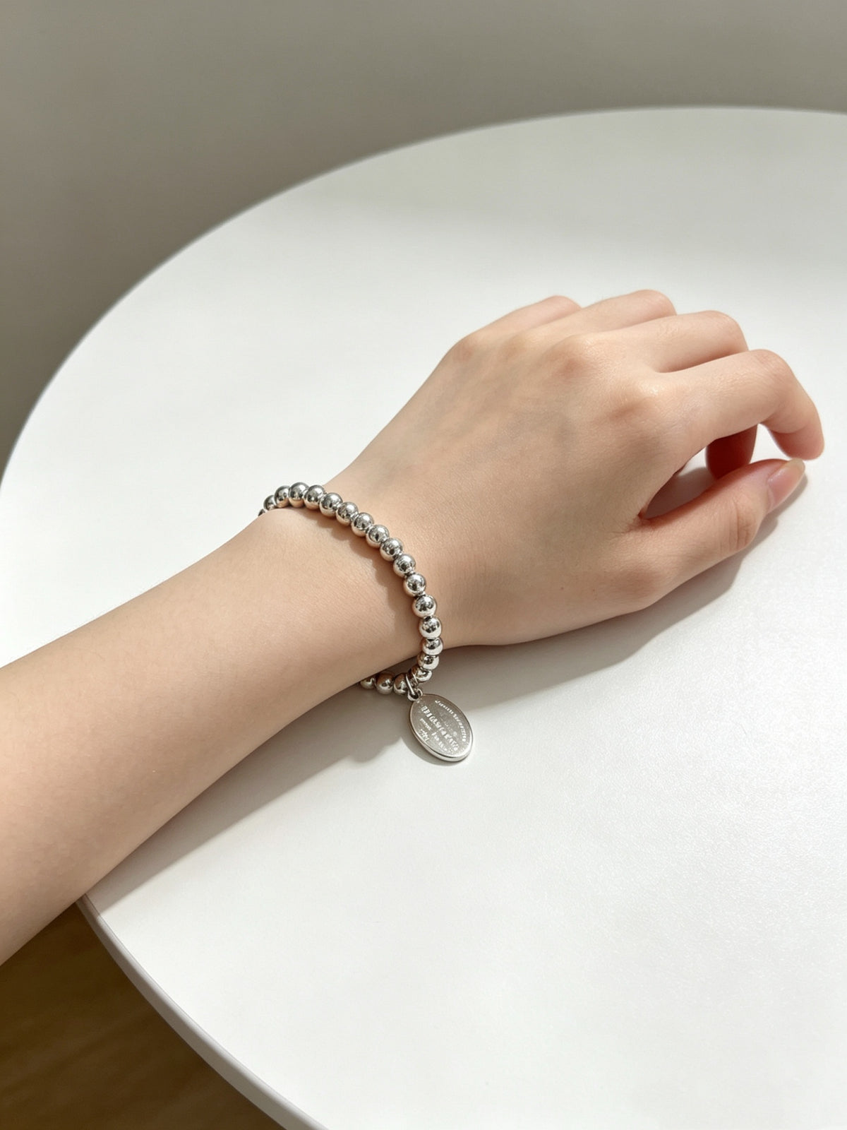 Signature Motif Bracelet in Silver-Tone – Vintage Detail front product view