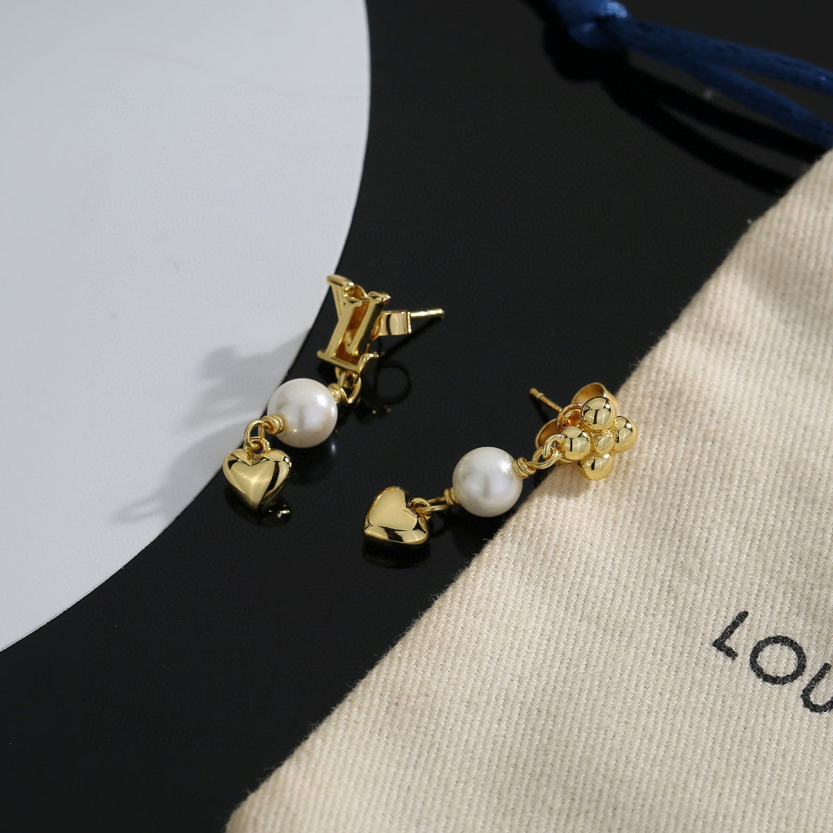 Letter Emblem Stud Earrings in Polished Metal-Tone – Design 004 close-up detail