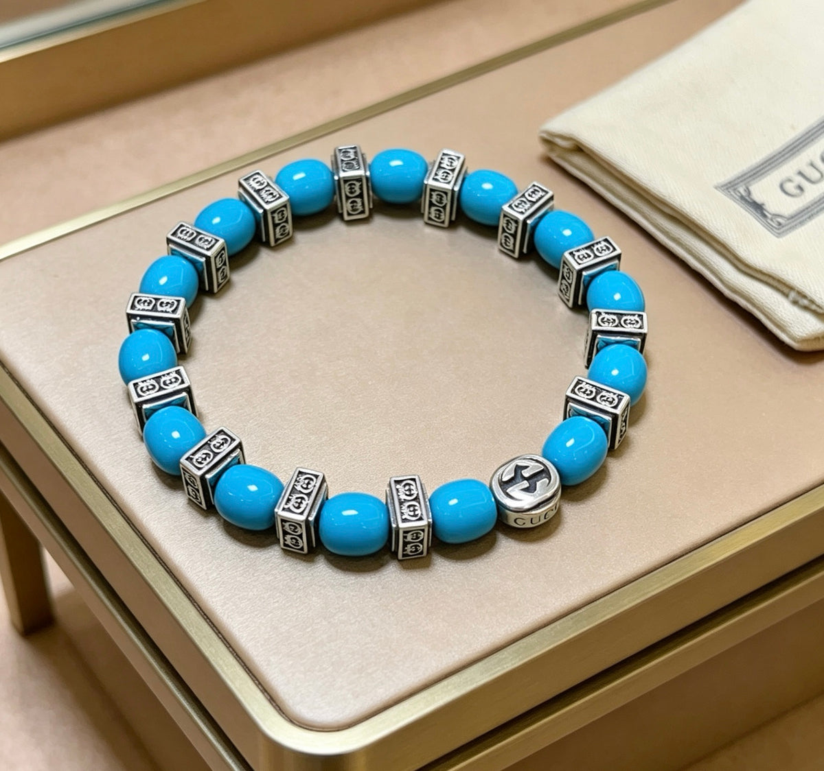 Double-G Emblem Beaded Bracelet in Polished Metal-Tone – Turquoise Detail front product view