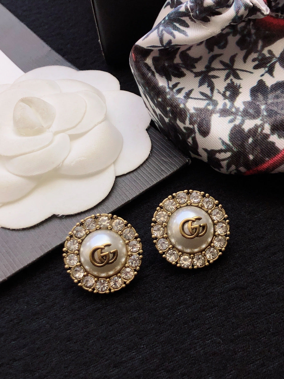 Letter Emblem Stud Earrings in Polished Metal-Tone front product view